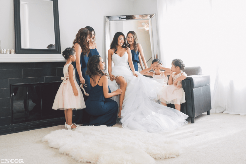 Michele sits with bridal party in her Lauren Elaine Jasmine Bridal Gown