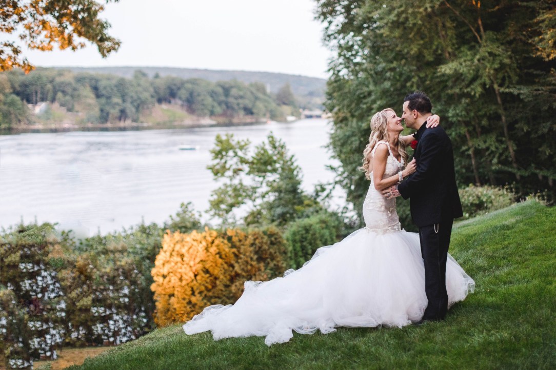 Bride Jenny poses with husband Nick in her Lauren Elaine Wisteria Gown in Conneticut