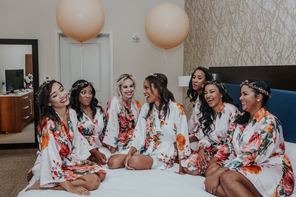 Bride Harmony and her bridal party in floral robes