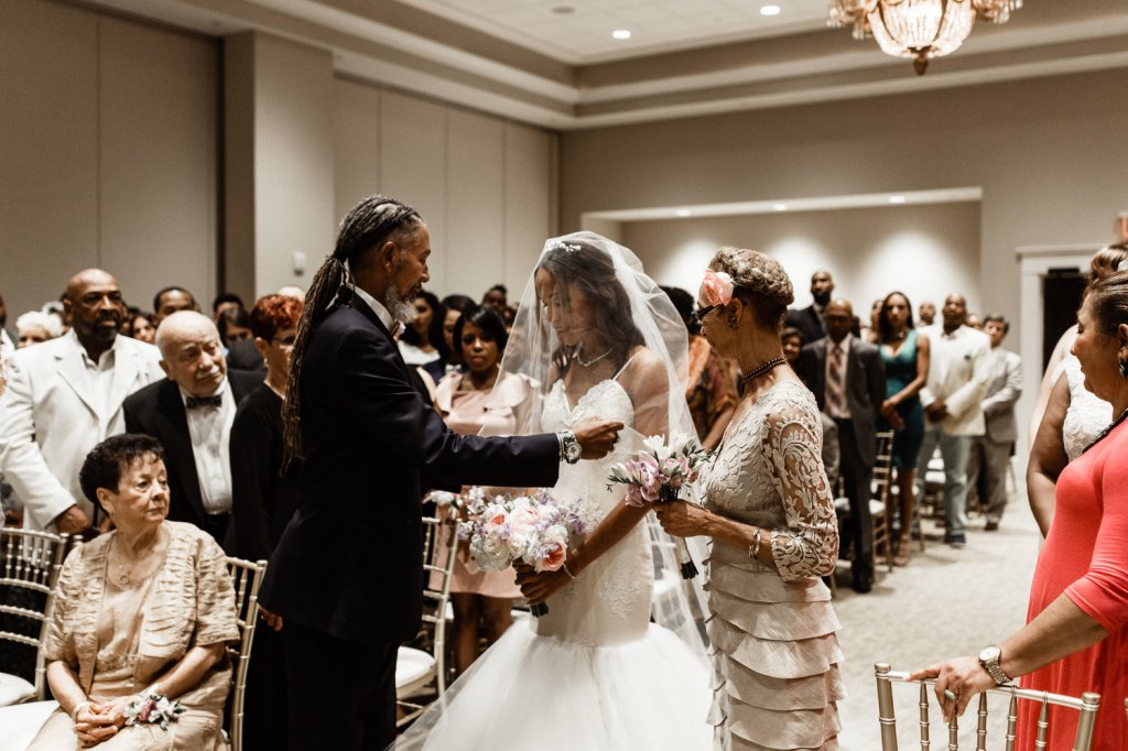 Bride Harmony walks down the aisle in her Lauren Elaine Arabelle wedding dress in Lafayette, Louisiana