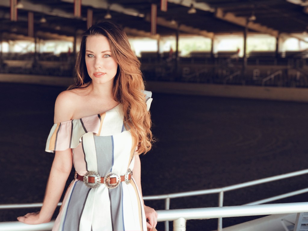 Los Angeles Fashion Designer Lauren Elaine poses at the LA Equestrian Center's Horse Show Arena