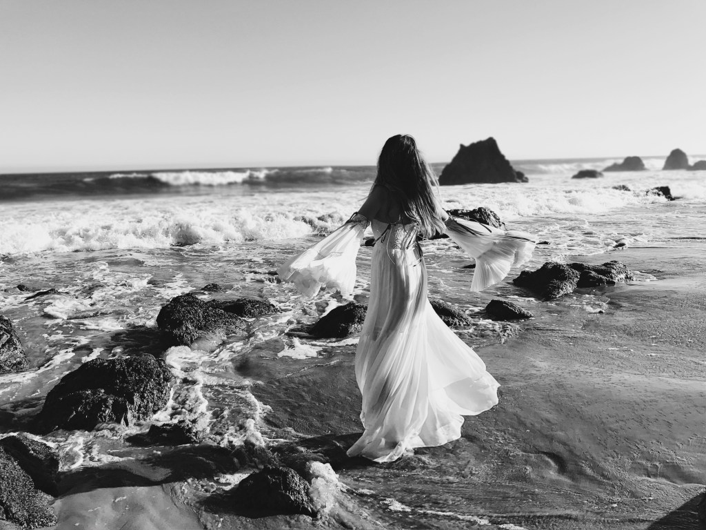 Ethereal fairytale fashion editorial featuring los angeles designer Lauren Elaine at el matador beach in malibu
