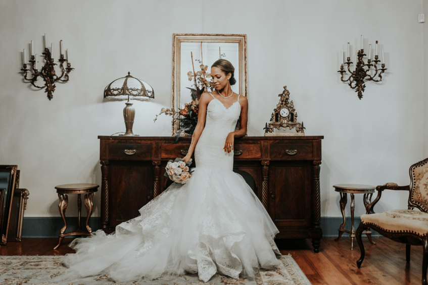 Bride Harmony poses for portraits in her Lauren Elaine Arabelle wedding dress
