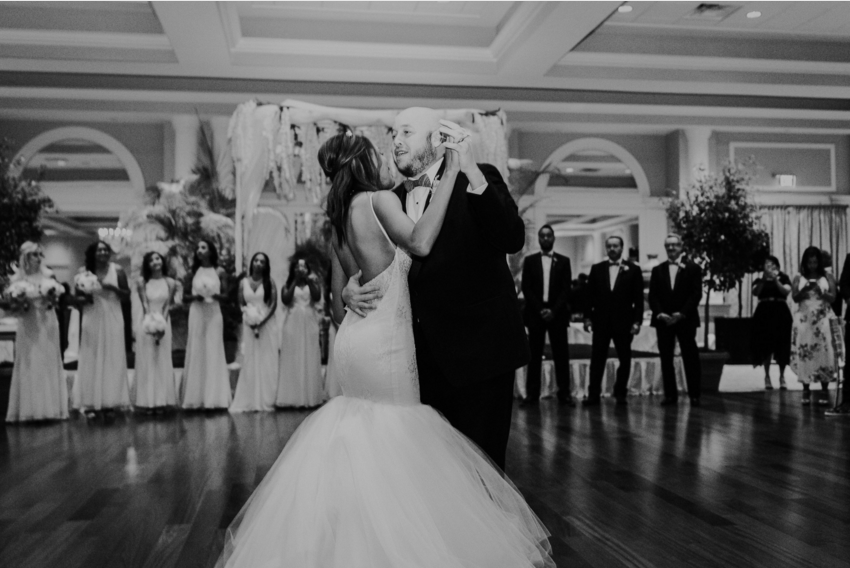 Bride Harmony shares a first dance in her Lauren Elaine Arabelle wedding gown at La Pavaillion