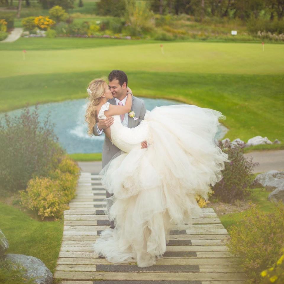 Bride Aprille wears a custom Lauren Elaine Aurelia gown