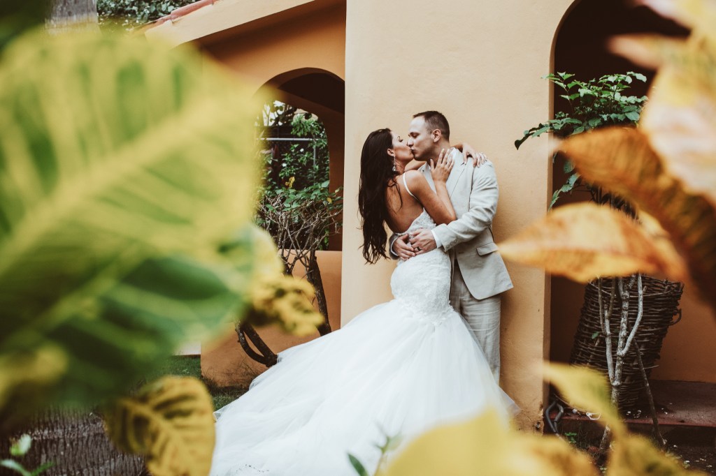 Bride Amy Lacey wears her custom Lauren Elaine "Calais" mermaid wedding dress with cathedral train