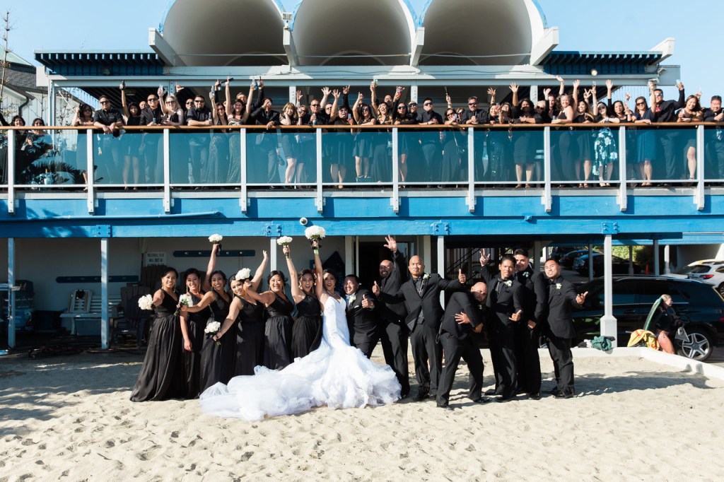 Bride Kimberly celebrates in her custom Lauren Elaine "Arabelle" mermaid wedding dress with 8ft train.