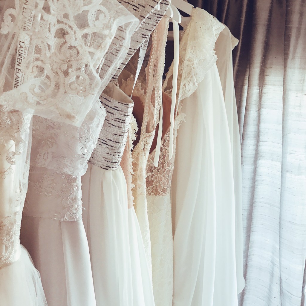 Wedding dresses and bridal gowns hanging on racks inside the Lauren Elaine Style House salon in Los Angeles.