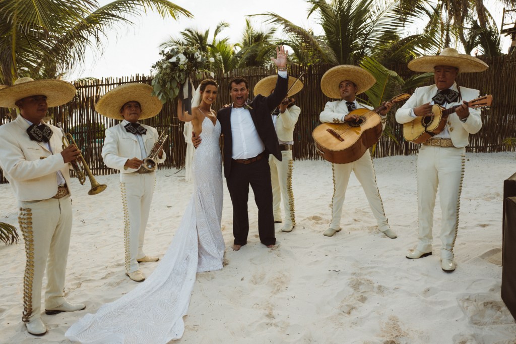 Bride Geniffer celebrates in Mexico with a Mariachi band and her custom Lauren Elaine "Prism" wedding dress.