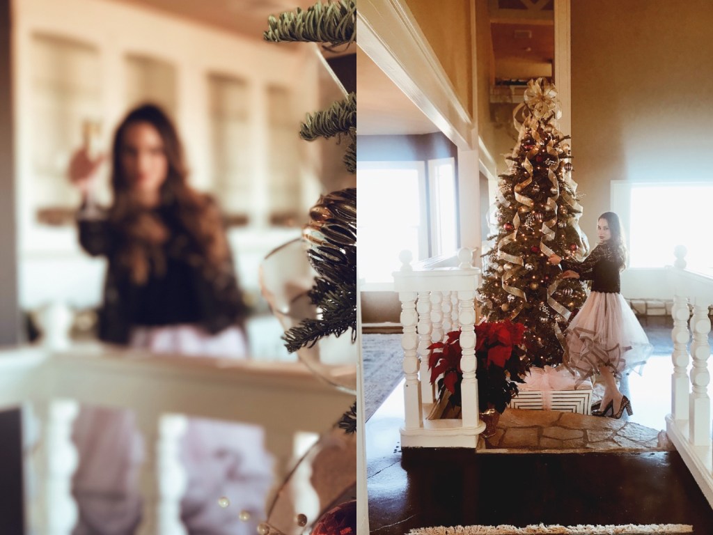 Holiday mantle decor with gold and silver ribbons and river rock.