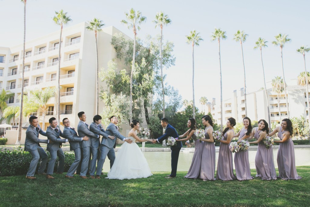 Bride Vicky wears a custom Lauren Elaine Magnolia ball gown wedding dress in Ivory 