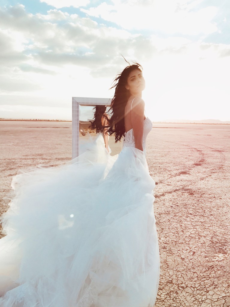 Lauren Elaine Elysian mermaid wedding dress editorial image with mirror in the desert at el mirage dry lake bed
