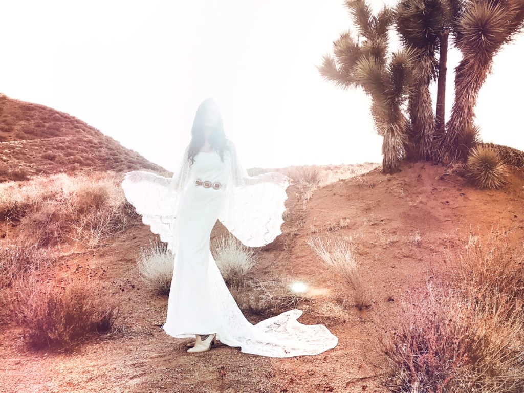 Bohemian angel wing cape sleeve wedding dress by Lauren Elaine Bridal