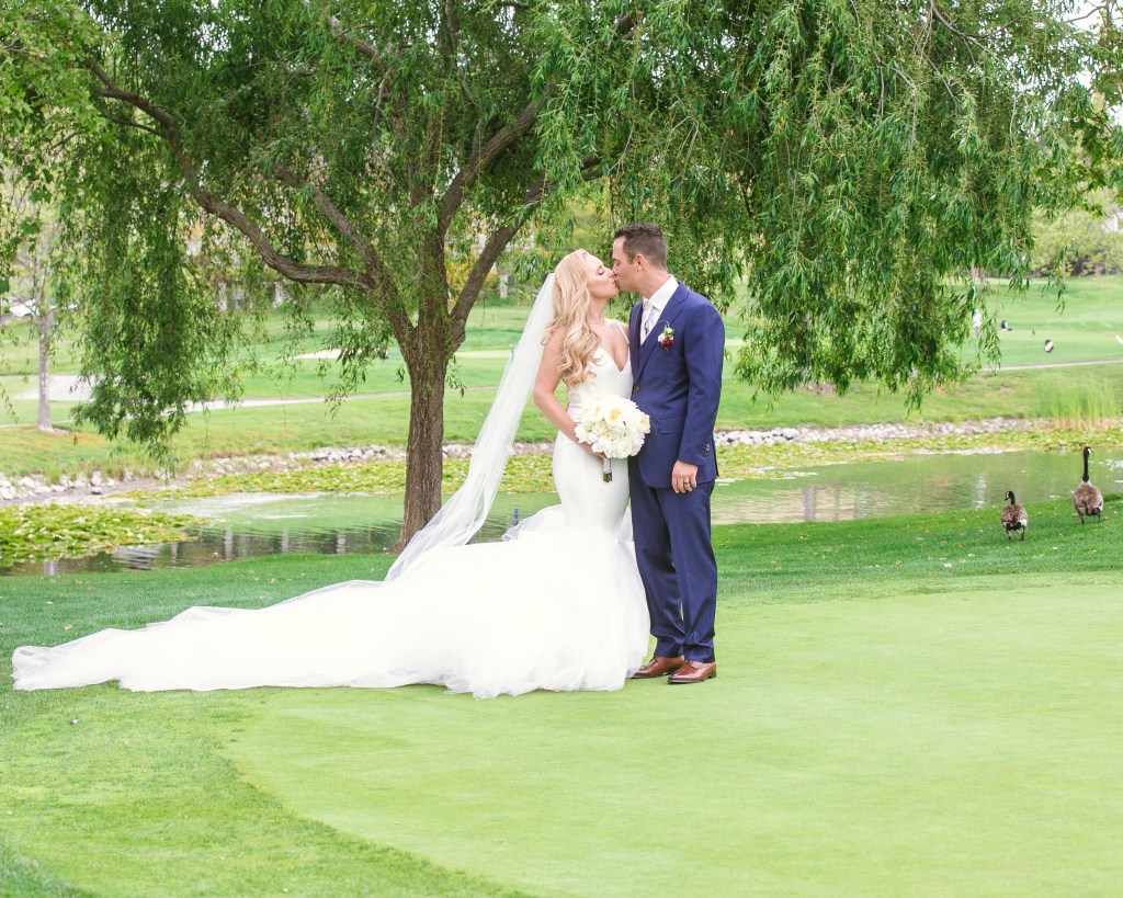 Bride Amanda celebrates her wedding in a custom Lauren Elaine "Epiphany" gown