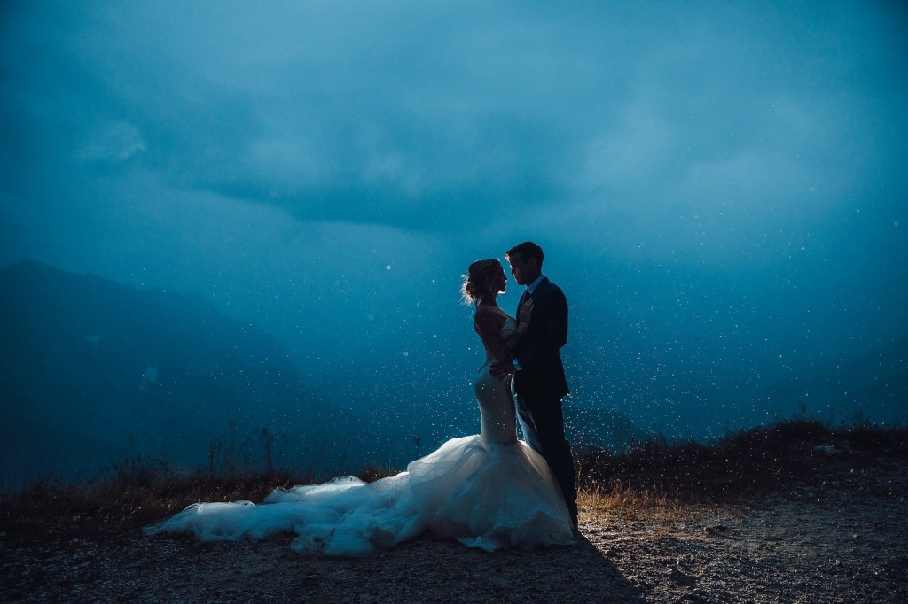A bride at Lake Bled, Slovenia in a custom Lauren Elaine mermaid "Epiphany" wedding dress