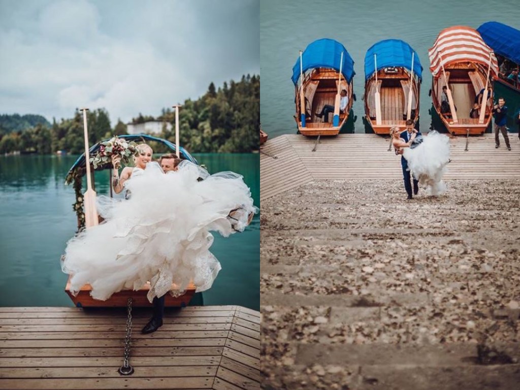 A bride gets carried up the stairs at Lake Bled, Slovenia