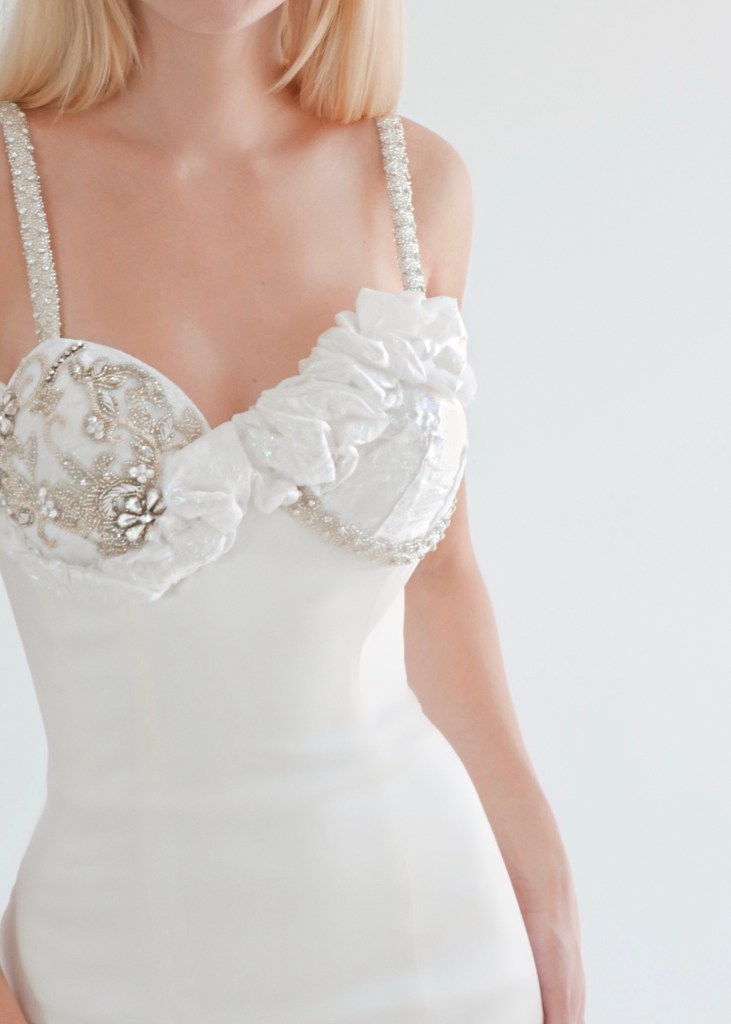 Crystal bead and ruffled organza details on the Lauren Elaine "Idol" Bustier Corset Wddding Gown on a model.