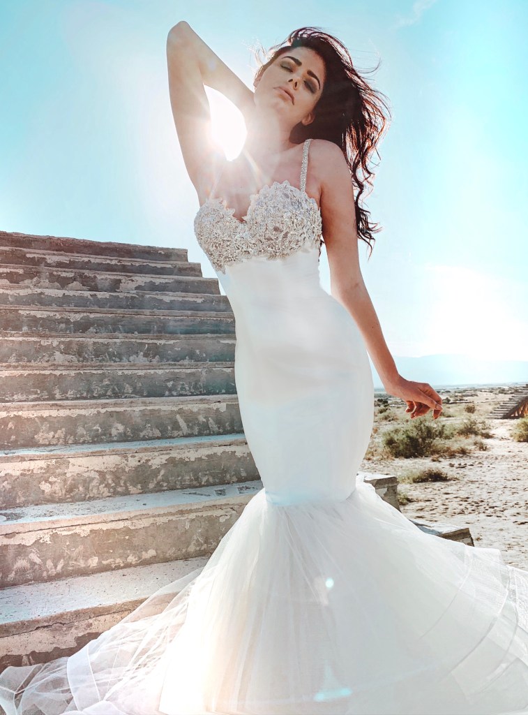 A model wears the Lauren Elaine "Infinity" sequin and crystal bustier corset wedding gown.