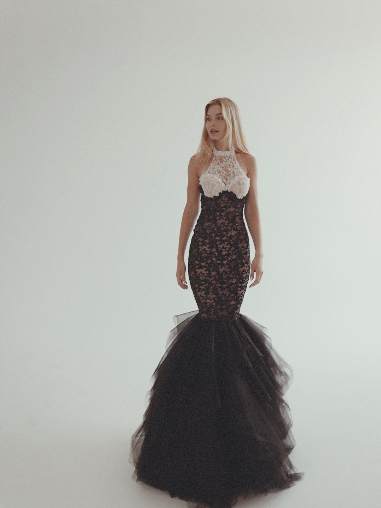 A Model wears the Lauren Elaine Raven Black Wedding Dress in a photo studio.