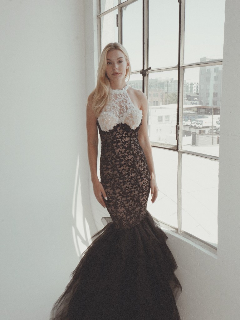 A model wears the Raven gown from the Coven Collection by Lauren Elaine Bridal in Los Angeles