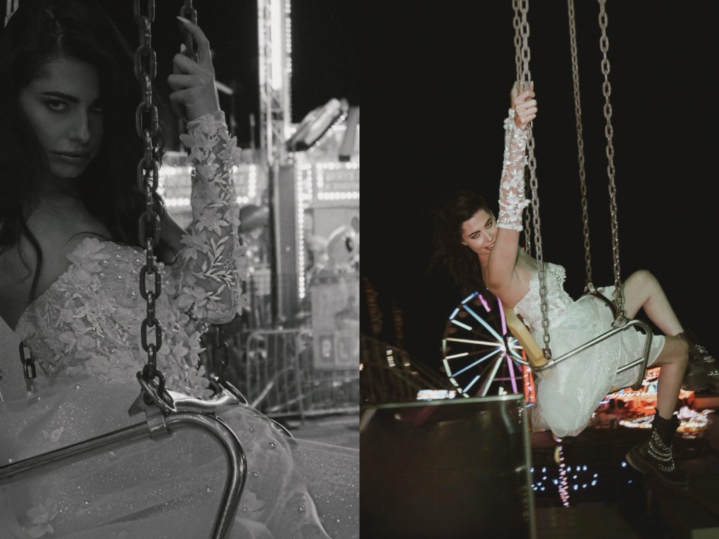 A model rides carnival swings in the Lauren Elaine Bridal Limelight Mini Dress