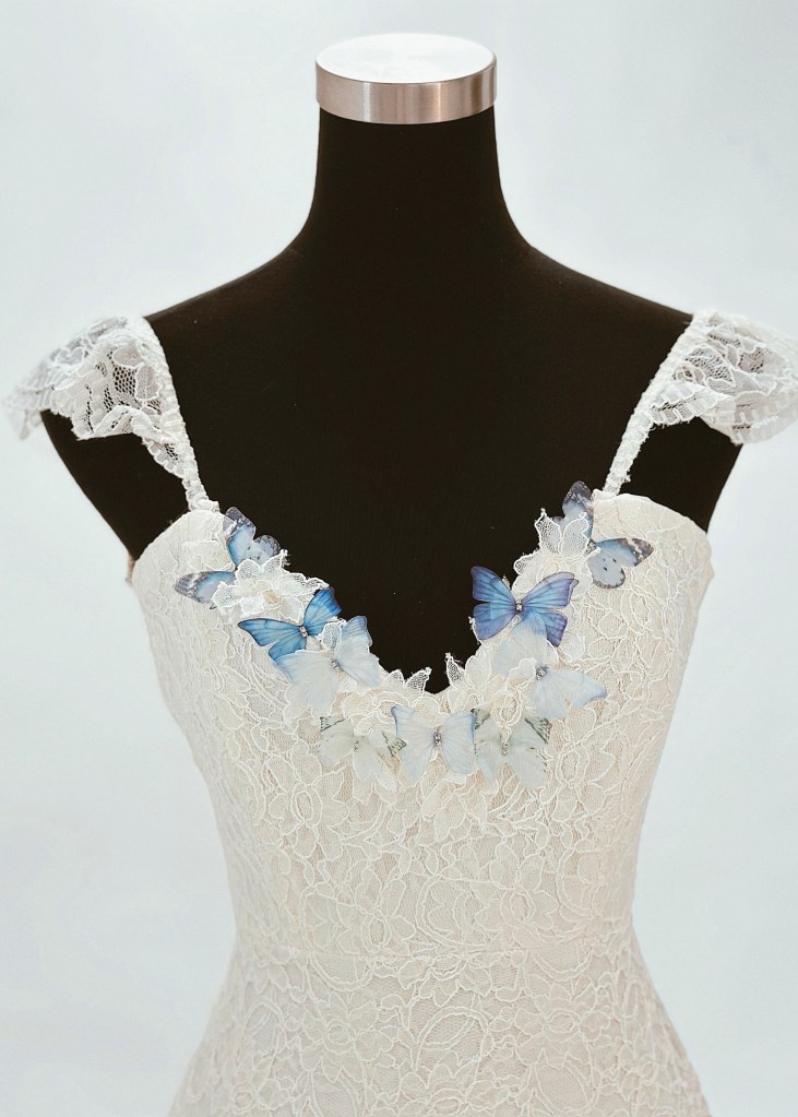 3D butterfly applique details on a whimsical wedding dress